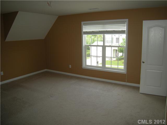 2401 Coltsgate Road, Unit 80 Waxhaw, NC 28173 - Photo 11 of 16 an empty room with a window