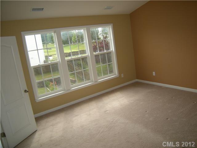 2401 Coltsgate Road, Unit 80 Waxhaw, NC 28173 - Photo 6 of 16 a view of an empty room with a window