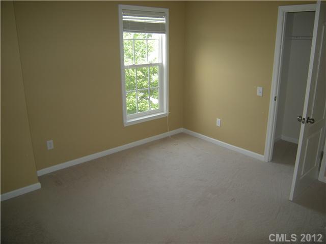 2401 Coltsgate Road, Unit 80 Waxhaw, NC 28173 - Photo 8 of 16 an empty room with a window