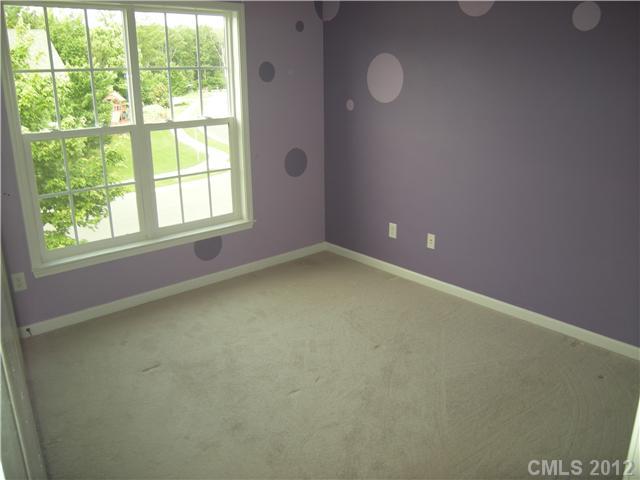 2401 Coltsgate Road, Unit 80 Waxhaw, NC 28173 - Photo 10 of 16 an empty room with a window