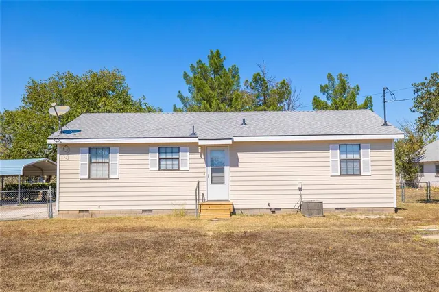 a house view with a backyard space