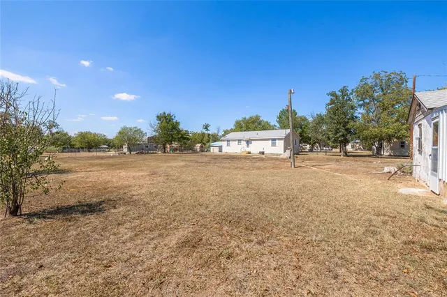 a view of a street with an outdoor space
