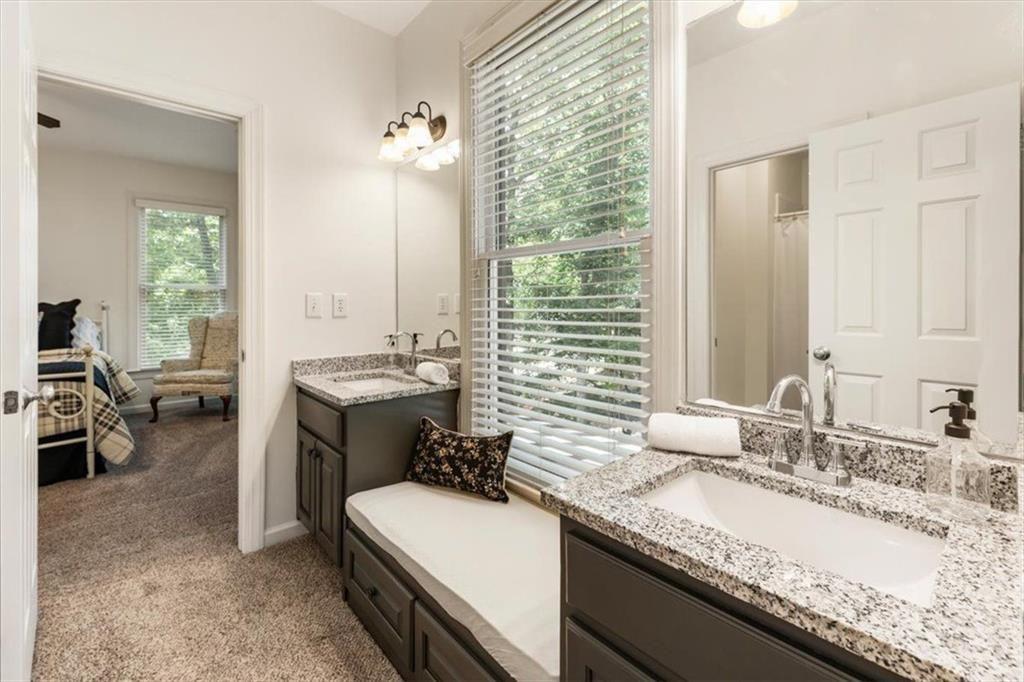 3910 Two Rivers Drive Cumming, GA 30041 - Photo 54 of 110 a bathroom with a granite countertop sink and a mirror