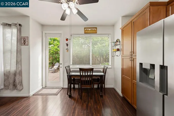 a view of a dining room with furniture window and wooden floor