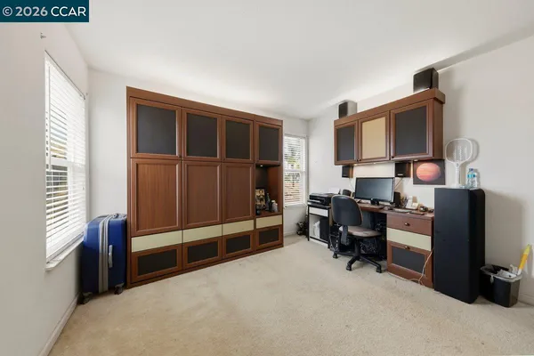 a workspace with furniture and window