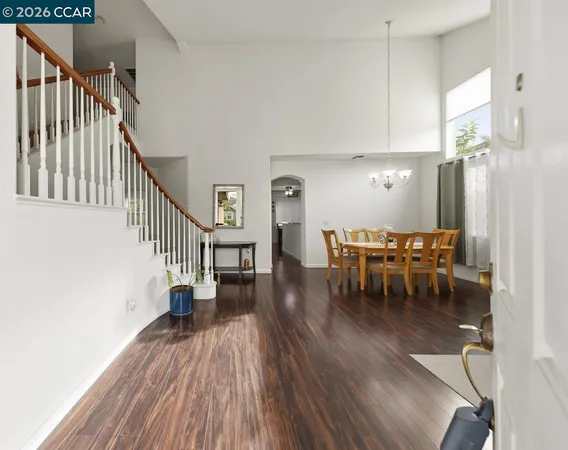 a view of dining room with furniture and wooden floor