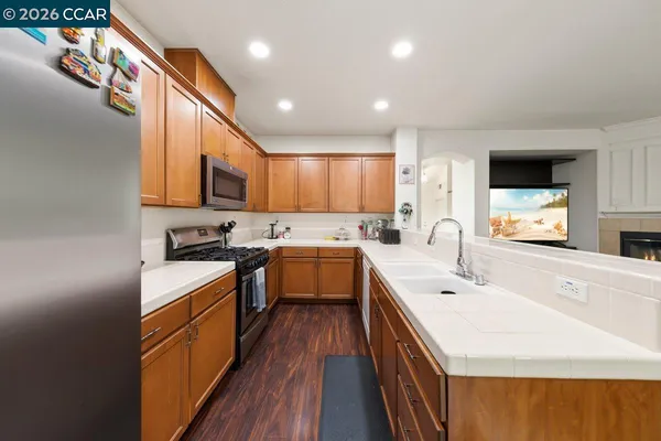 a kitchen with a sink stove and cabinets