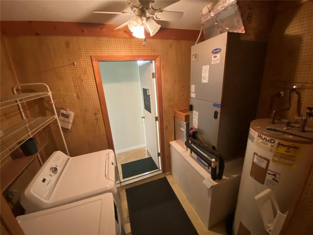26840 Racquet Circle Leesburg, FL 34748 - Photo 17 of 19 a room with storage and utility