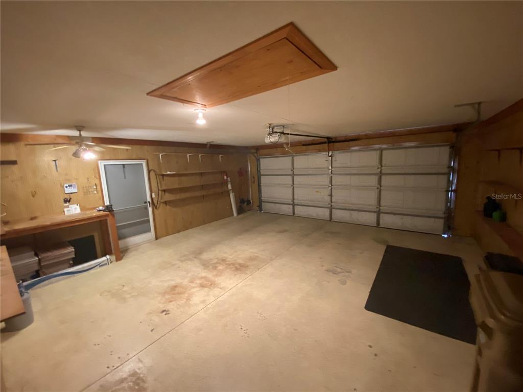 26840 Racquet Circle Leesburg, FL 34748 - Photo 18 of 19 a view of a garage room