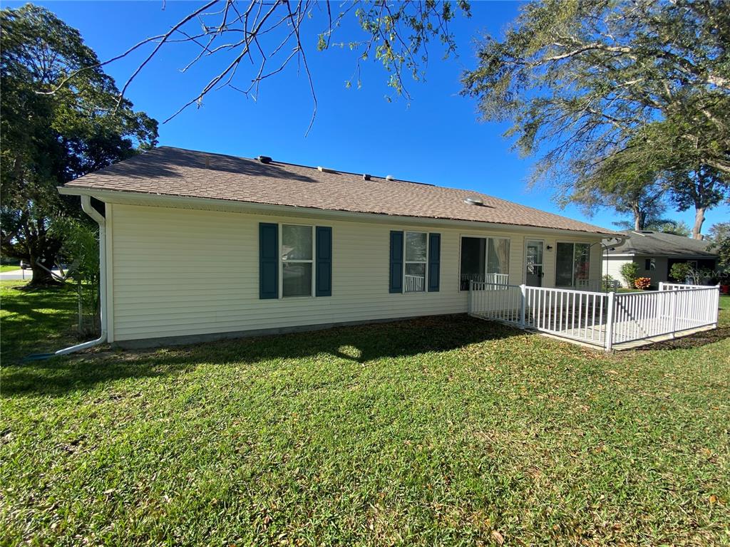 26840 Racquet Circle Leesburg, FL 34748 - Photo 19 of 19 a front view of a house with a yard