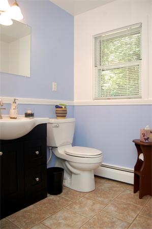 190 Boston Street Middleton, MA 01949 - Photo 12 of 25 a bathroom with a sink vanity mirror and toilet