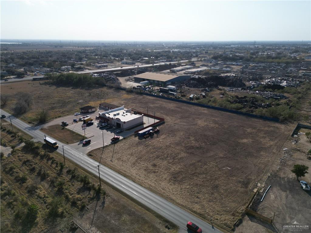 an aerial view of a house with a ocean view