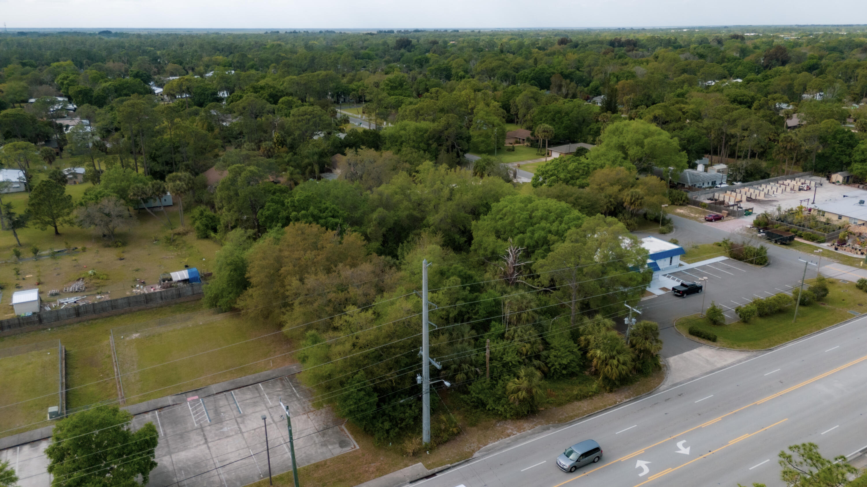 0 South Wickham Road Melbourne, FL 32904 - Photo 2 of 14 an aerial view of a houses with a yard