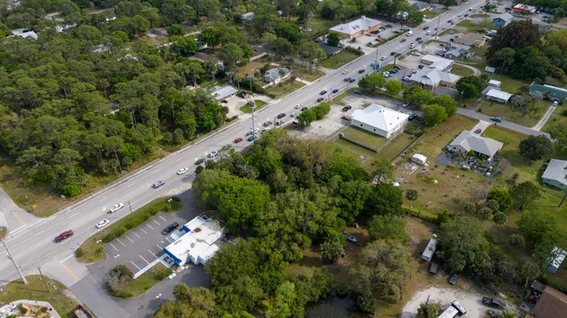 an aerial view of a residential houses with outdoor space