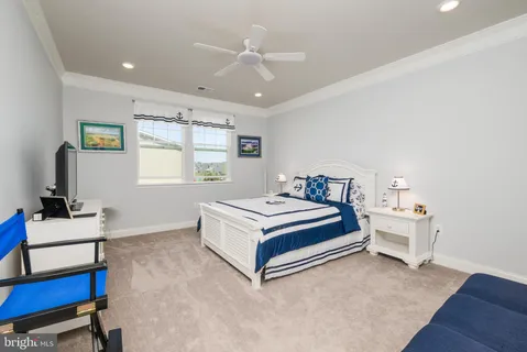 a bedroom with a bed and a desk