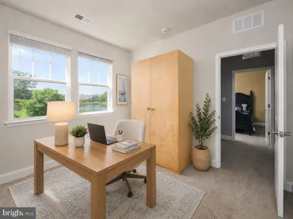 a view of a workspace with a window and dining table