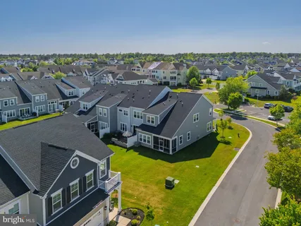 an aerial view of a house with a swimming pool