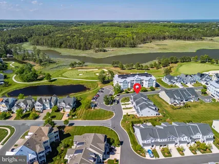 an aerial view of residential house with outdoor space and swimming pool