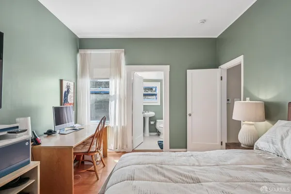 a bedroom with furniture and a bed