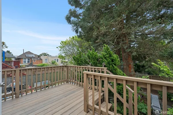 a view of deck with mountain view and wooden floor