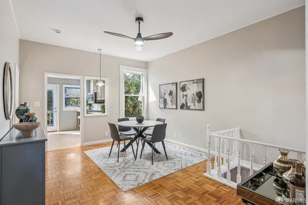 a view of a dining room with furniture window and wooden floor