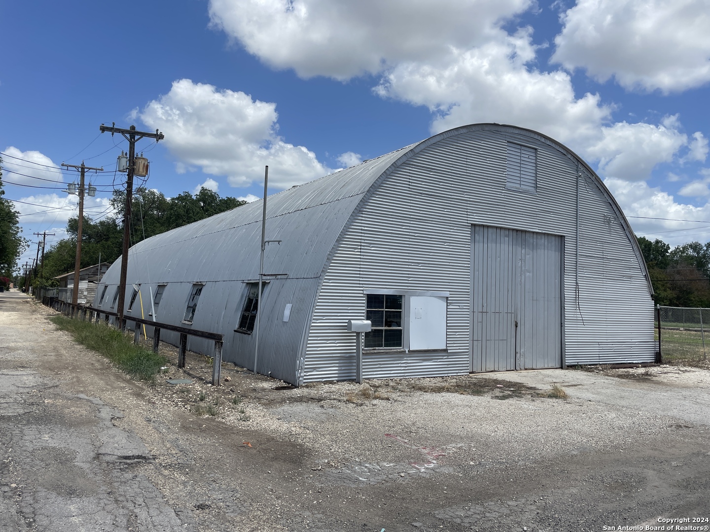 1905 Ave R Hondo, TX 78861 - Photo 2 of 8 a view of a house with backyard and a tree
