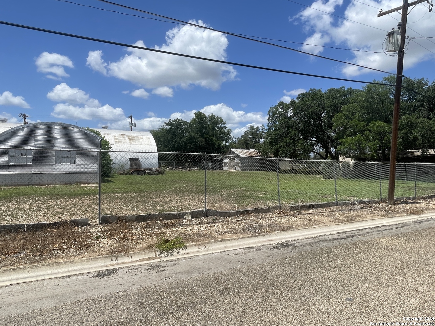 1905 Ave R Hondo, TX 78861 - Photo 8 of 8 a view of a street with a building in the background