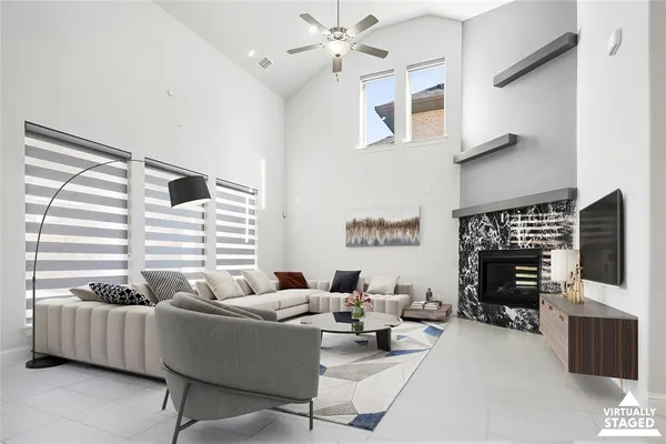 a living room with furniture and a fireplace