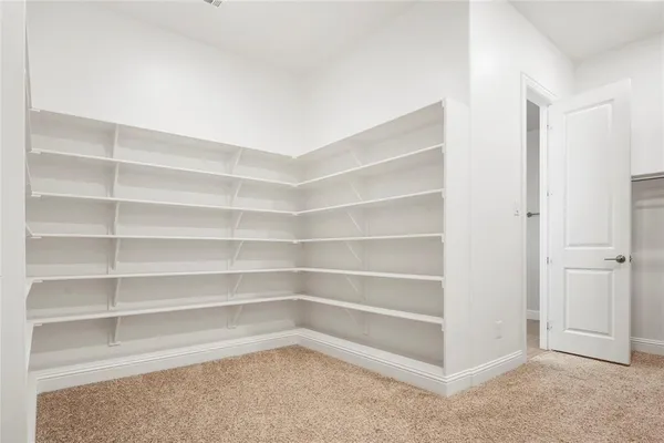 a room with a closet and a wooden floor