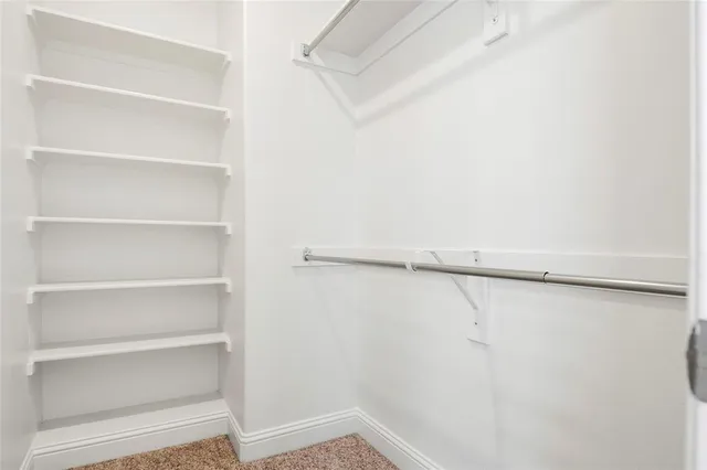 a bathroom with a granite countertop sink a toilet and a bathtub