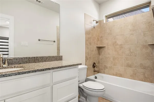 a view of a storage & utility room with two washing machine
