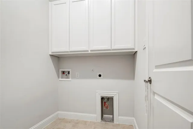 a view of a house with brick walls