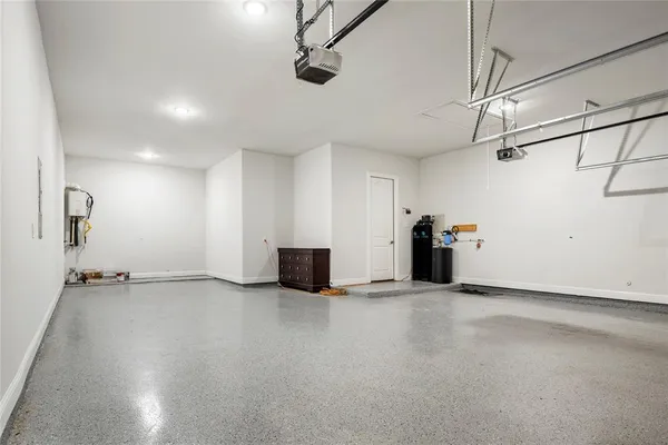 a view of a house with pool and sitting area