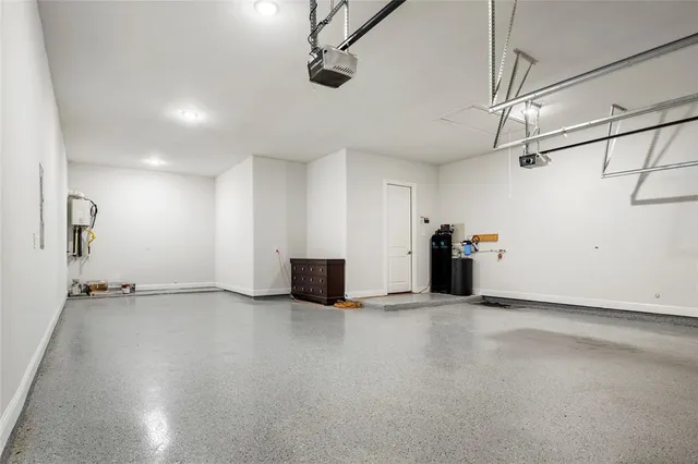 a view of a house with pool and sitting area