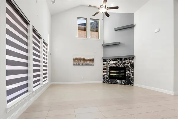a view of a utility room with cabinets