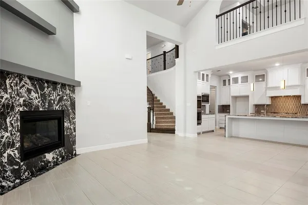 a view of a kitchen with furniture and staircase