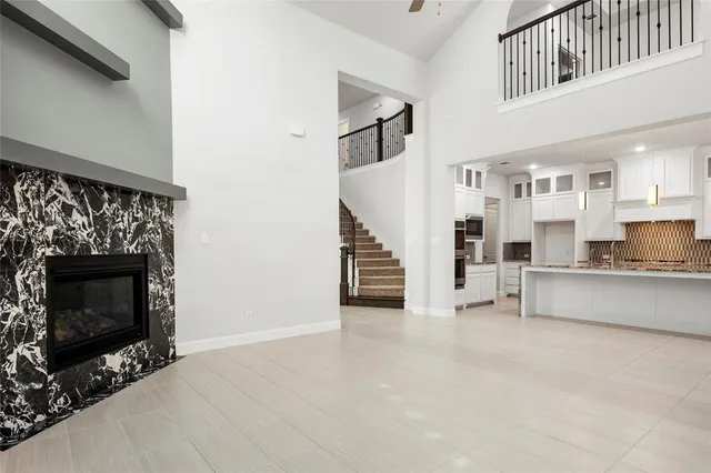 a view of a kitchen with furniture and staircase