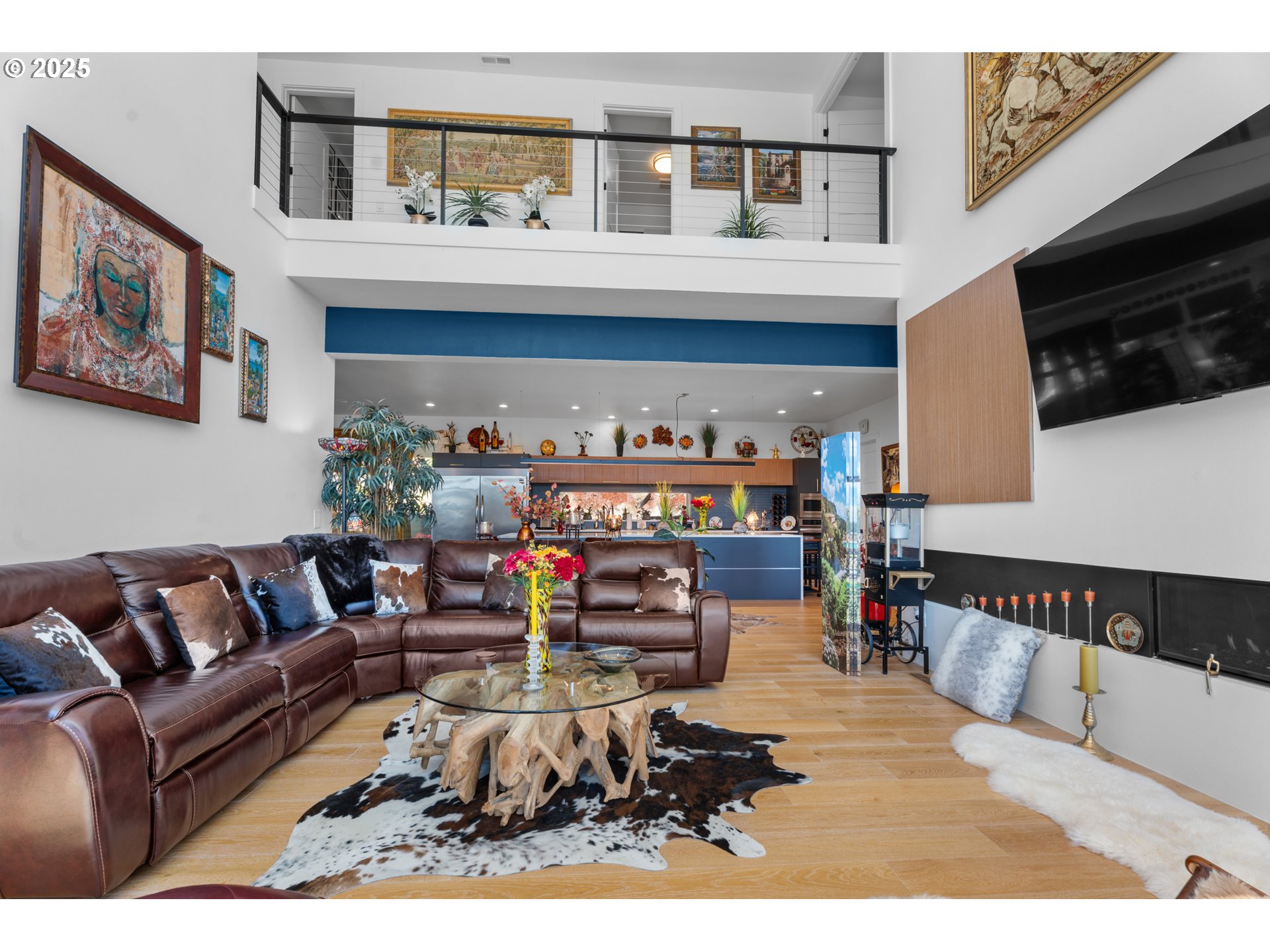 1345 North R Street Washougal, WA 98671 - Photo 13 of 46 a living room with furniture a flat screen tv and a wall paintings