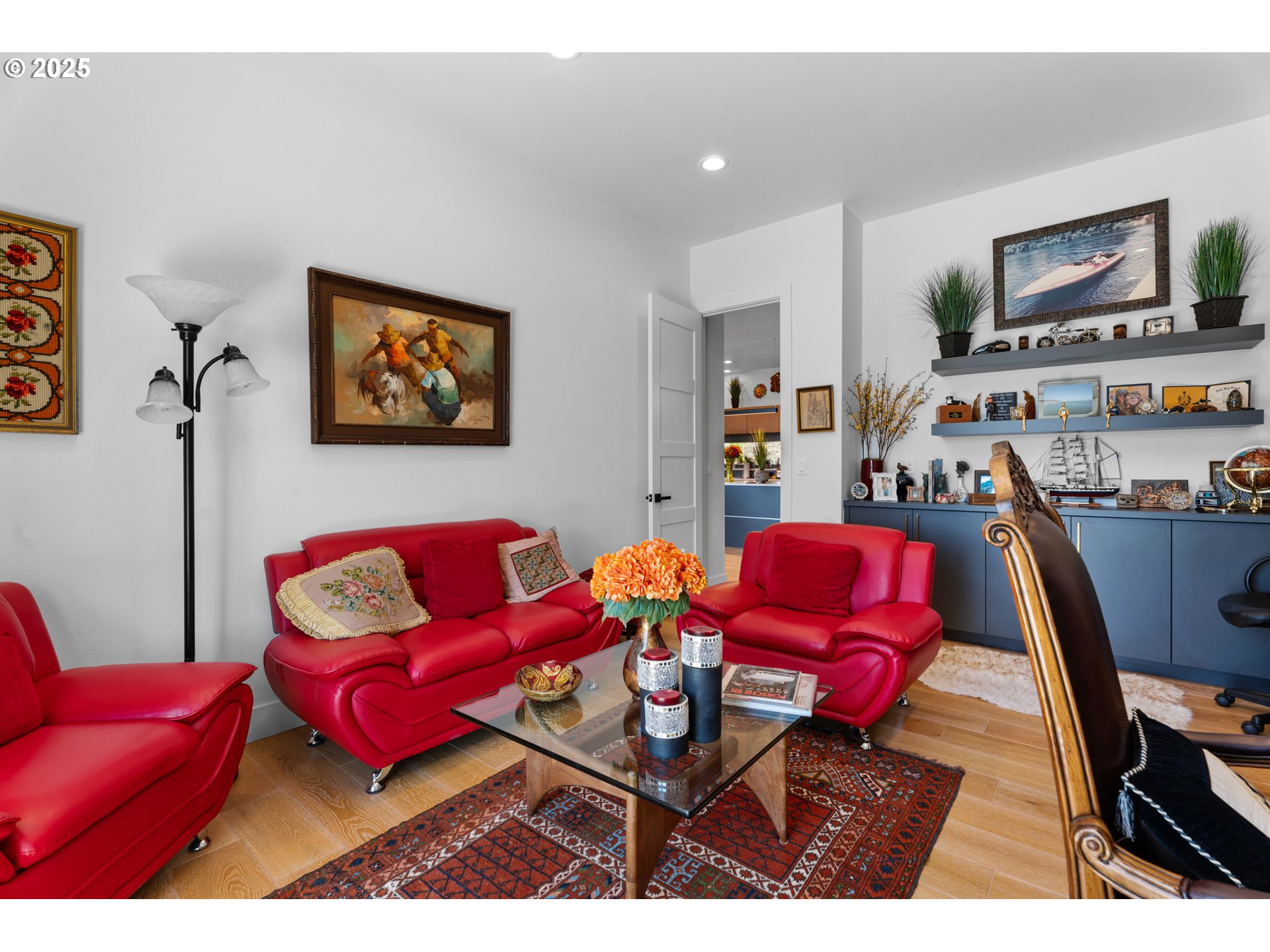1345 North R Street Washougal, WA 98671 - Photo 17 of 46 a living room with furniture a red chair and a flat screen tv