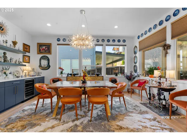 a living room with stainless steel appliances kitchen island granite countertop furniture and a large window