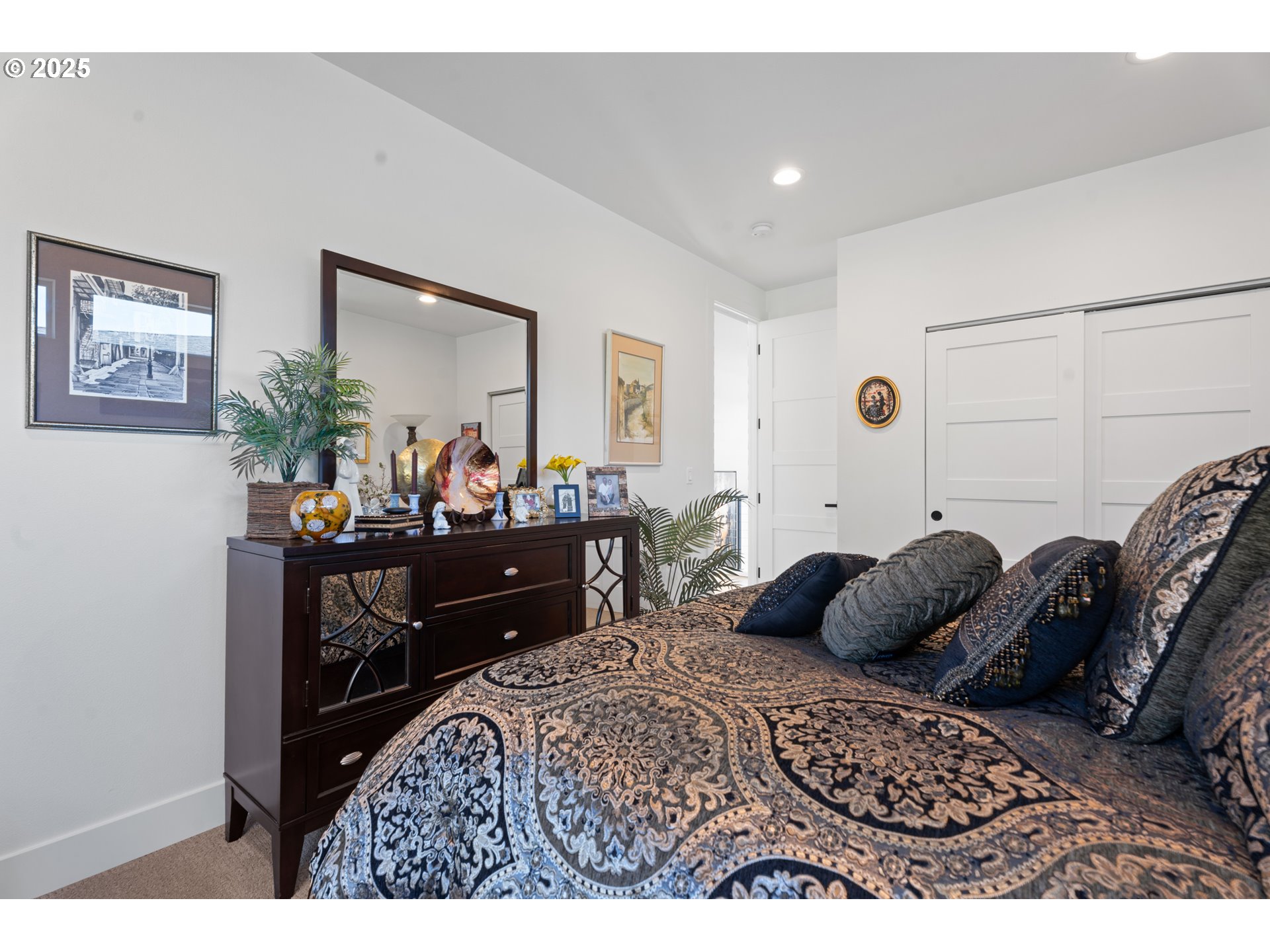 1345 North R Street Washougal, WA 98671 - Photo 23 of 46 a bedroom with a bed a table and painting on the wall