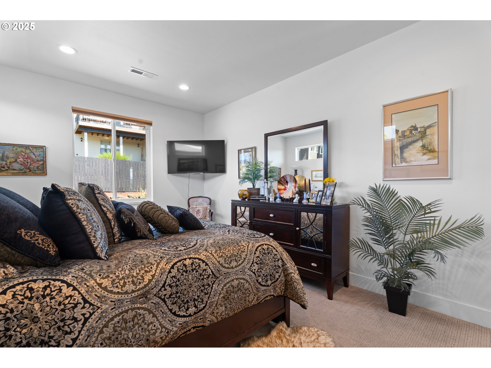 1345 North R Street Washougal, WA 98671 - Photo 24 of 46 a bedroom with furniture and a flat screen tv