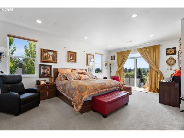 a bedroom with a bed and glass window