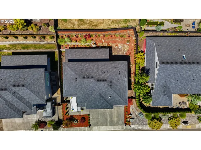 an aerial view of a house with a yard