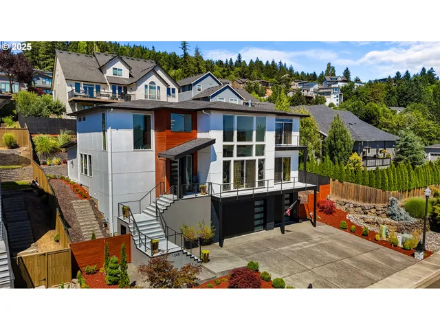 an aerial view of a house with a yard