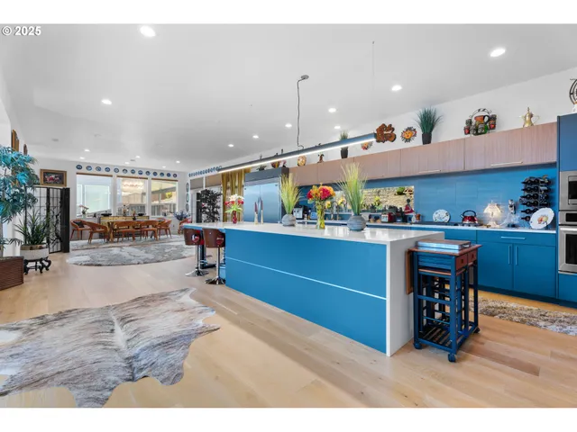 a living room with lots of furniture and clutter