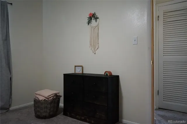 a room with a table and a fireplace