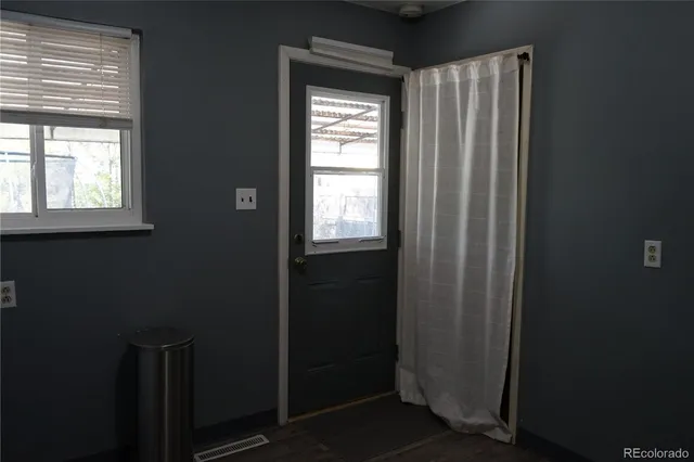 a view of empty room with windows