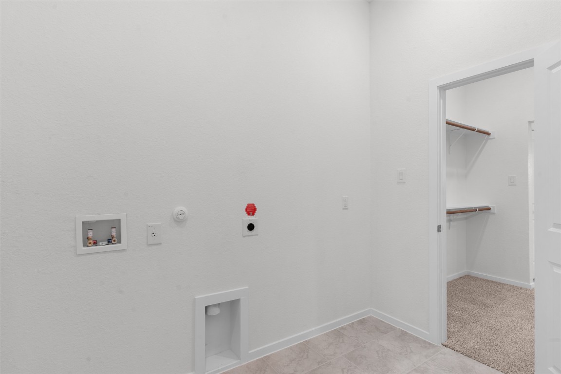 13821 Tucker Hedge Pass Elgin, TX 78621 - Photo 15 of 31 Washroom with gas dryer hookup, washer hookup, and hookup for an electric dryer