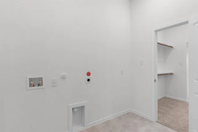 a view of a livingroom with wooden floor and white walls